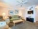 Comfortable living room with plush seating, lamps, and beach-themed decor at 4225 S Atlantic Ave # 218, New Smyrna Beach, FL 32169