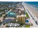 Gorgeous aerial view of beachfront condos, coastline and cityscape with ocean and white sandy beach at 425 S Atlantic Ave # 302, New Smyrna Beach, FL 32169