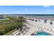Aerial view showcasing beachside lounge area, pool and ocean views at 425 S Atlantic Ave # 302, New Smyrna Beach, FL 32169