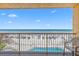 Breathtaking balcony view overlooking the pool and beach with lounge chairs at 425 S Atlantic Ave # 302, New Smyrna Beach, FL 32169