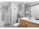 Well-lit bathroom featuring a shower-tub combo with a clean, bright vanity at 425 S Atlantic Ave # 302, New Smyrna Beach, FL 32169