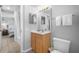 Cozy bathroom featuring a vanity, toilet, mirror, vanity lighting, and shower with curtain at 425 S Atlantic Ave # 302, New Smyrna Beach, FL 32169