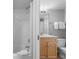 Bathroom featuring a shower-tub combo, vanity with new mirror and lighting at 425 S Atlantic Ave # 302, New Smyrna Beach, FL 32169