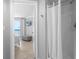 Hallway view of a bright bathroom and bedroom with a beach view at 425 S Atlantic Ave # 302, New Smyrna Beach, FL 32169