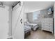 Bright and cozy bedroom featuring two twin beds and a dresser at 425 S Atlantic Ave # 302, New Smyrna Beach, FL 32169
