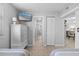 Bedroom featuring two twin beds, a dresser, flat screen television, and closet with sliding door at 425 S Atlantic Ave # 302, New Smyrna Beach, FL 32169