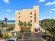 Oceanfront building features a private beach access, covered parking and tropical landscaping at 425 S Atlantic Ave # 302, New Smyrna Beach, FL 32169