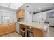 Clean kitchen with eat-in bar, modern appliances and updated sink, faucet, and countertops at 425 S Atlantic Ave # 302, New Smyrna Beach, FL 32169