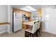 Functional kitchen equipped with modern appliances, breakfast bar, and ample counter space at 425 S Atlantic Ave # 302, New Smyrna Beach, FL 32169