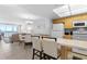 Open-concept kitchen flowing into the living and dining area, with ocean views in the background at 425 S Atlantic Ave # 302, New Smyrna Beach, FL 32169