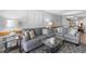 Inviting living room with comfortable grey sofas, decorative lamps, and stylish center table at 425 S Atlantic Ave # 302, New Smyrna Beach, FL 32169