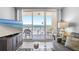 Inviting living room with comfortable seating and sliding glass doors leading to the balcony at 425 S Atlantic Ave # 302, New Smyrna Beach, FL 32169