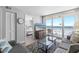Relaxing living room with comfortable sofa, TV and balcony access to the beach at 425 S Atlantic Ave # 302, New Smyrna Beach, FL 32169