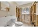 Bathroom ready for renovation featuring a toilet and window with natural light at 431 Palmetto St, Edgewater, FL 32132