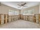Bedroom ready for renovation with ample natural light and ceiling fan at 431 Palmetto St, Edgewater, FL 32132
