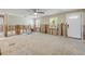 Spacious living room ready for renovation with ample natural light and front door at 431 Palmetto St, Edgewater, FL 32132