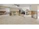 Spacious living room ready for renovation with ample natural light and ceiling fan at 431 Palmetto St, Edgewater, FL 32132