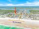 Aerial view of a beach community with beachfront properties and easy access to the ocean at 4350 Candlewood Ln, Ponce Inlet, FL 32127