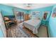 Bright bedroom with a sliding door leading to a pool, complemented by a ceiling fan at 4350 Candlewood Ln, Ponce Inlet, FL 32127