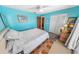 Comfortable bedroom featuring a bed, ample closet space, and tiled floors at 4350 Candlewood Ln, Ponce Inlet, FL 32127