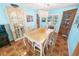 Dining room showcasing a decorative chandelier and ample seating for gatherings at 4350 Candlewood Ln, Ponce Inlet, FL 32127
