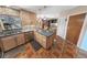 Functional kitchen with stainless steel appliances, generous counter space, and convenient access to dining area at 4350 Candlewood Ln, Ponce Inlet, FL 32127