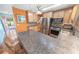 Well-equipped kitchen featuring stainless steel appliances, granite countertops, and ample cabinet space at 4350 Candlewood Ln, Ponce Inlet, FL 32127