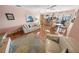 Bright and airy living room with comfortable seating and views of the outdoor dining area at 4350 Candlewood Ln, Ponce Inlet, FL 32127