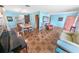 Spacious living room with dining area, tiled floors, and plenty of room for entertaining guests at 4350 Candlewood Ln, Ponce Inlet, FL 32127