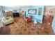 Bright and airy living room with ample space, tiled floors, and seamless flow into the dining area at 4350 Candlewood Ln, Ponce Inlet, FL 32127