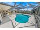 Beautiful pool area is screened in, offering comfort, privacy, and an outdoor oasis at 4350 Candlewood Ln, Ponce Inlet, FL 32127
