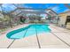 The screened-in pool area showcases space for dining and lounging at 4350 Candlewood Ln, Ponce Inlet, FL 32127