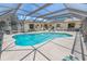 Enjoy Florida living in your private, screened-in pool area, perfect for relaxation and entertainment at 4350 Candlewood Ln, Ponce Inlet, FL 32127