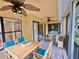 Cozy outdoor balcony features comfortable seating and a stylish ceiling fan at 439 Bouchelle Dr # 202, New Smyrna Beach, FL 32169