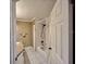 A bathroom with a granite countertop, a shower-tub combo, and neutral tile flooring at 439 Bouchelle Dr # 202, New Smyrna Beach, FL 32169