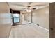 A large, bright bedroom features neutral colors and a window overlooking the outside at 439 Bouchelle Dr # 202, New Smyrna Beach, FL 32169