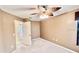 Bedroom with a ceiling fan and window at 439 Bouchelle Dr # 202, New Smyrna Beach, FL 32169