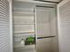 Open closet with adjustable shelves and bars for organizing clothes, towels and personal items at 439 Bouchelle Dr # 202, New Smyrna Beach, FL 32169