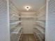 Walk-in closet features adjustable wire shelving for organized storage at 439 Bouchelle Dr # 202, New Smyrna Beach, FL 32169