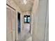 Hallway with closet space leading into a bedroom featuring a fan and natural lighting at 439 Bouchelle Dr # 202, New Smyrna Beach, FL 32169