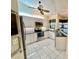 Well-equipped kitchen features modern appliances, white cabinets, and a sunny window at 439 Bouchelle Dr # 202, New Smyrna Beach, FL 32169