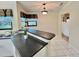 Bright kitchen features sleek countertops and an eat-in breakfast bar near a window at 439 Bouchelle Dr # 202, New Smyrna Beach, FL 32169