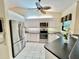 Bright kitchen features modern appliances, sleek countertops and white cabinets at 439 Bouchelle Dr # 202, New Smyrna Beach, FL 32169