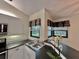 Bright kitchen features modern appliances, sleek countertops, and a view to the outside at 439 Bouchelle Dr # 202, New Smyrna Beach, FL 32169