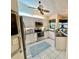 Well-equipped kitchen features modern appliances, white cabinets, and a sunny window at 439 Bouchelle Dr # 202, New Smyrna Beach, FL 32169