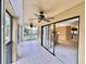 Covered lanai with ceiling fans and views of the property and surrounding neighborhood at 439 Bouchelle Dr # 202, New Smyrna Beach, FL 32169