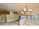 Spacious living room with vaulted ceilings, fan, chandelier and natural light at 439 Bouchelle Dr # 202, New Smyrna Beach, FL 32169