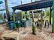 Outdoor kitchen features a stainless grill, countertops, and convenient setup for cooking and dining al fresco at 439 Bouchelle Dr # 202, New Smyrna Beach, FL 32169