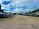 Boats parked on trailers sit on a well lit, gravel lot ready for fun on the water at 439 Bouchelle Dr # 202, New Smyrna Beach, FL 32169