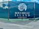 A sign advertises the Bouchelle Island Sportplex at the edge of the tennis court at 439 Bouchelle Dr # 202, New Smyrna Beach, FL 32169